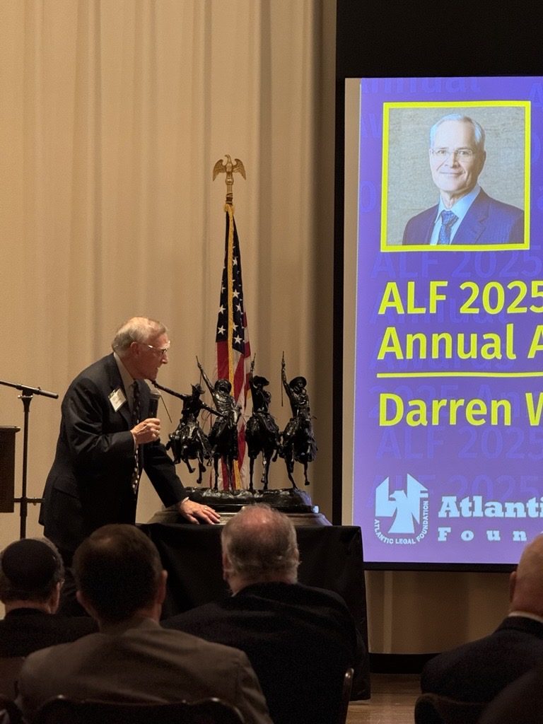The Atlantic Legal Foundation Annual Award, a bronze of Remington's Coming Through the Rye, on stage